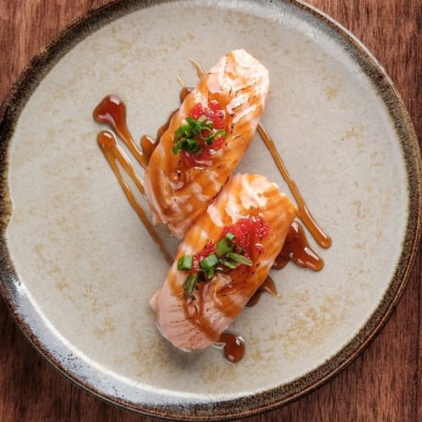 Seared salmon nigiri finished with a citrus glaze