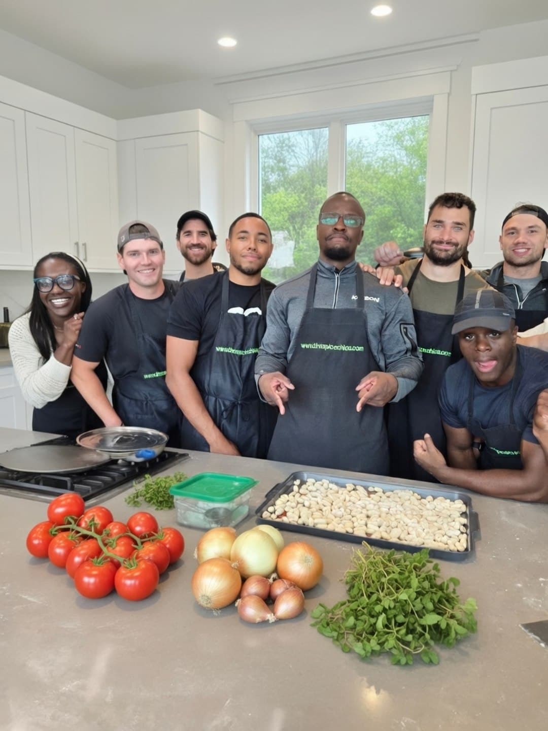 Team plating a course mid-service during a kitchen challenge