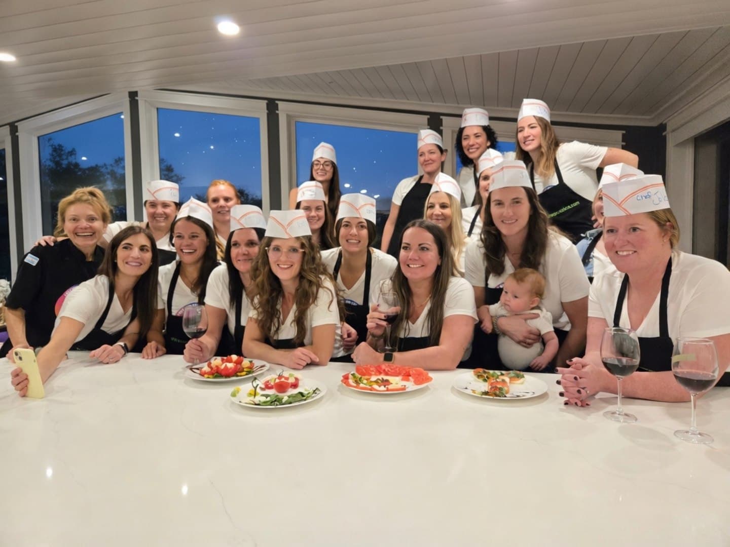 Colleagues cooking together at a Calgary corporate holiday party