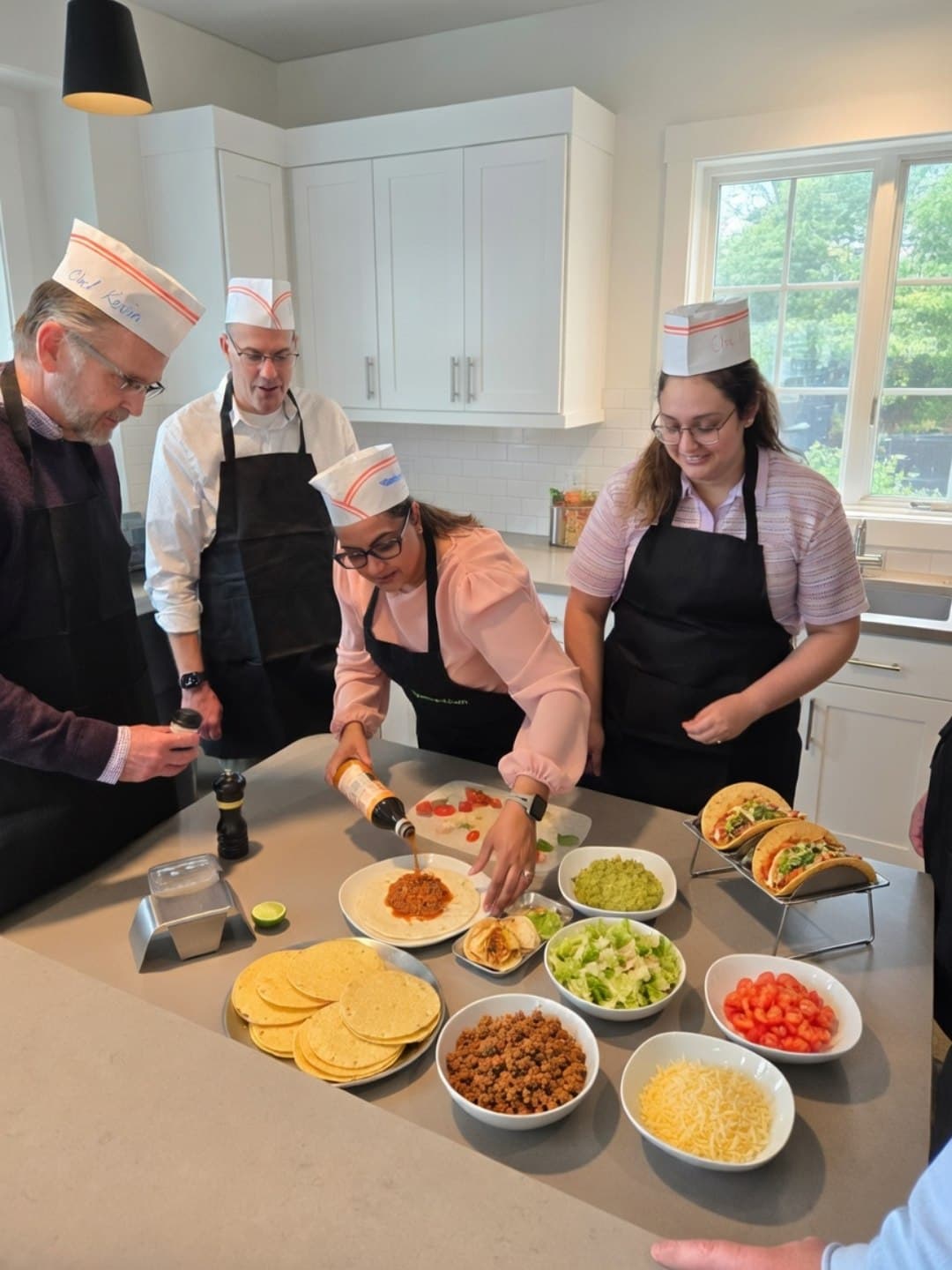 Hands shaping fresh pasta during a cooking class in Calgary